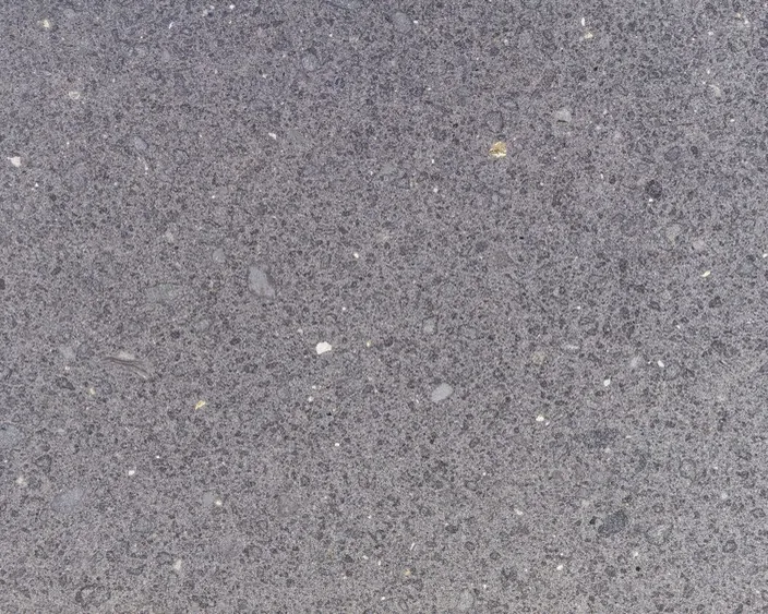 Placa de Basalto Lavagrigia: gris violáceo granulado con inclusiones blancas
