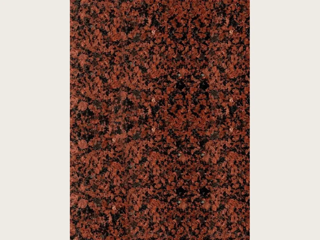 Placa de granito rojo Balmoral Red: fondo rojo ladrillo con puntos negros repartidos y sin vetas