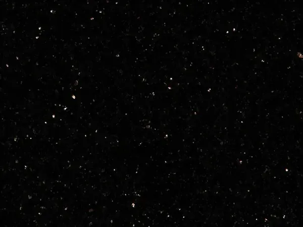 Placa de Granito Star Galaxy: fondo negro moteado con pequeños puntos dorados y cobre brillantes