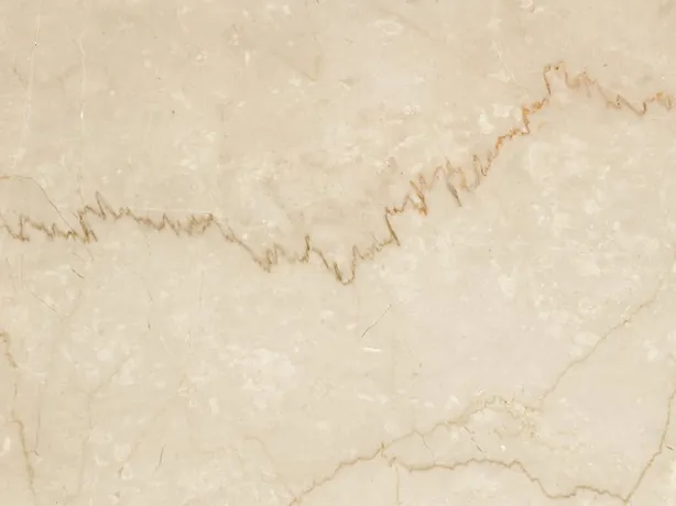 Detalle del Botticino Classico: veta dentada marrón claro sobre el beige