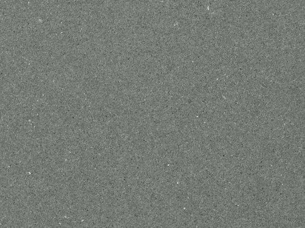 Detalle del Gris Aitos: grano fino y salpicado parejo de puntos claros y oscuros