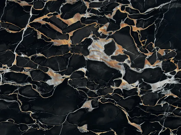 Detalle del Mármol Nero Portoro: vetas doradas y blancas finas a medianas sobre el negro pulido