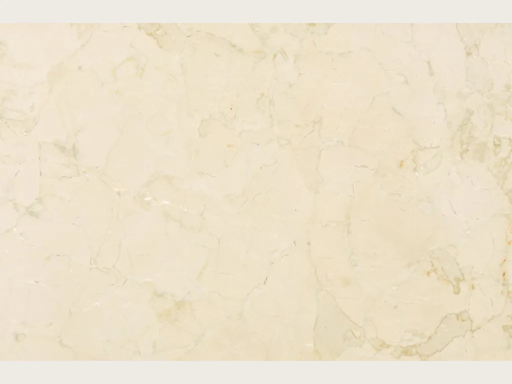 Placa de mármol beige Pietra Orsera: fondo crema claro con red de vetas beige muy tenues