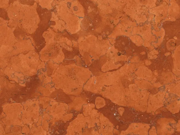Detalle del Mármol Rojo Asiago: manchas claras sobre la matriz rojo óxido en acabado mate